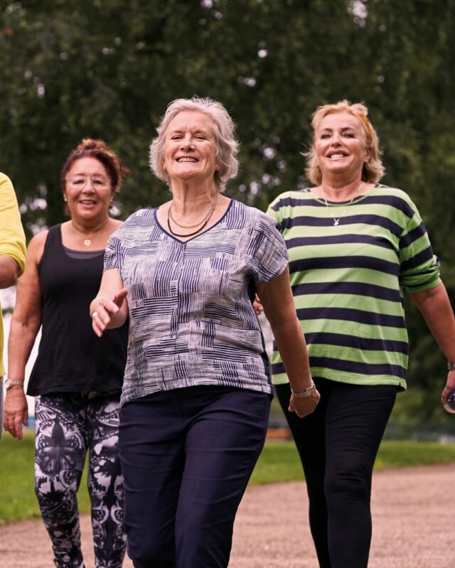 four ladies walking in the park