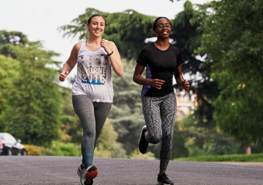 two people running along a path