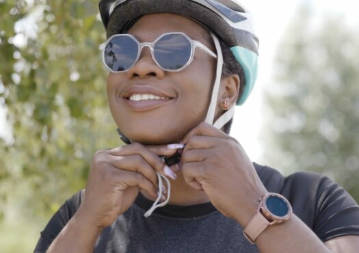 Abi putting on her helmet